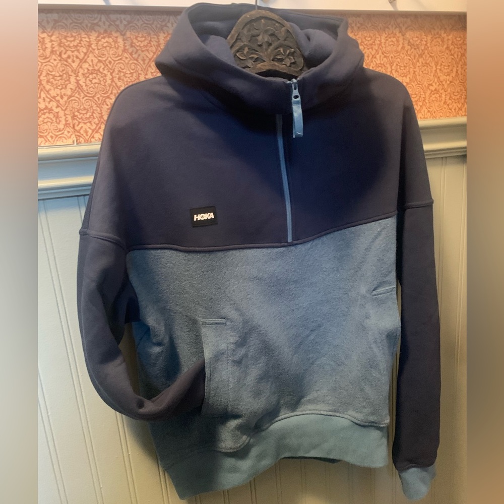 Size large women’s Hoka 1/2 zip / half wool hoodie.